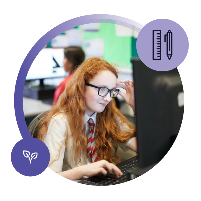 Pupil working at a computer in a classroom