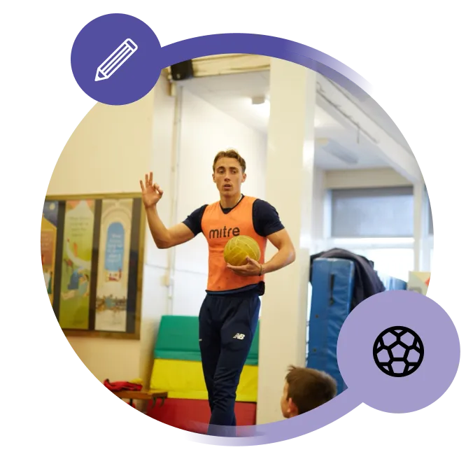 PE teacher holding a ball in a school hall